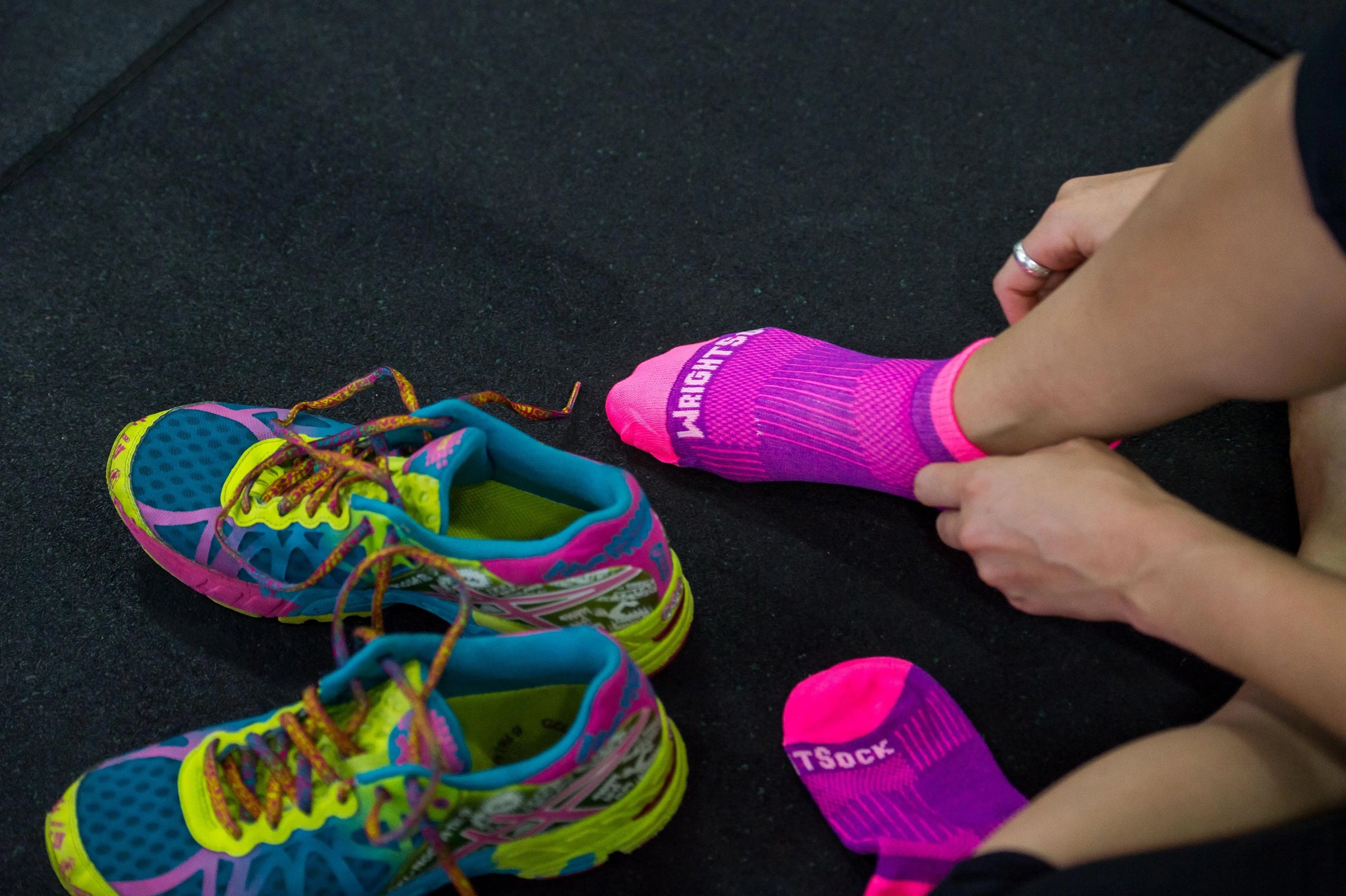 woman putting on blister free socks