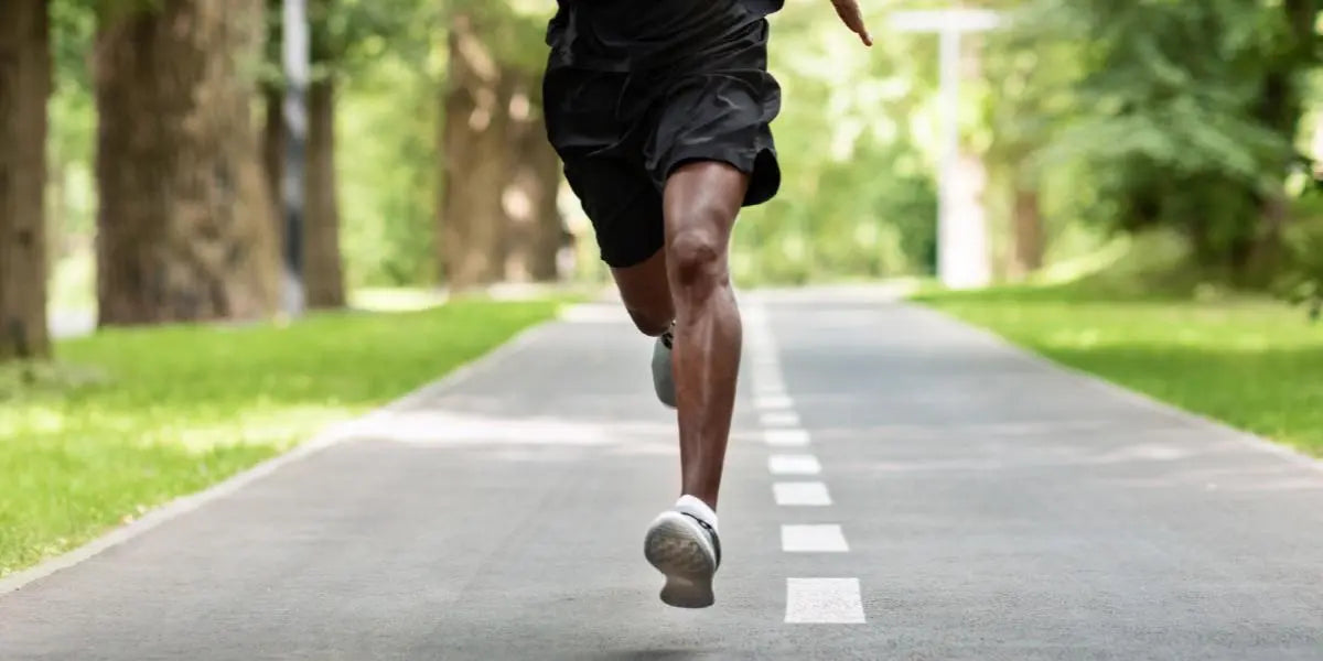 An individual running on a road.